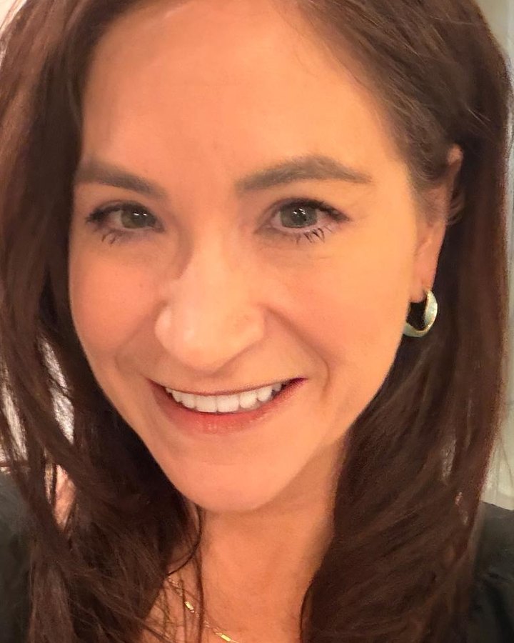 Erika Palmer Mandel, founder of HeartPrint, smiling.